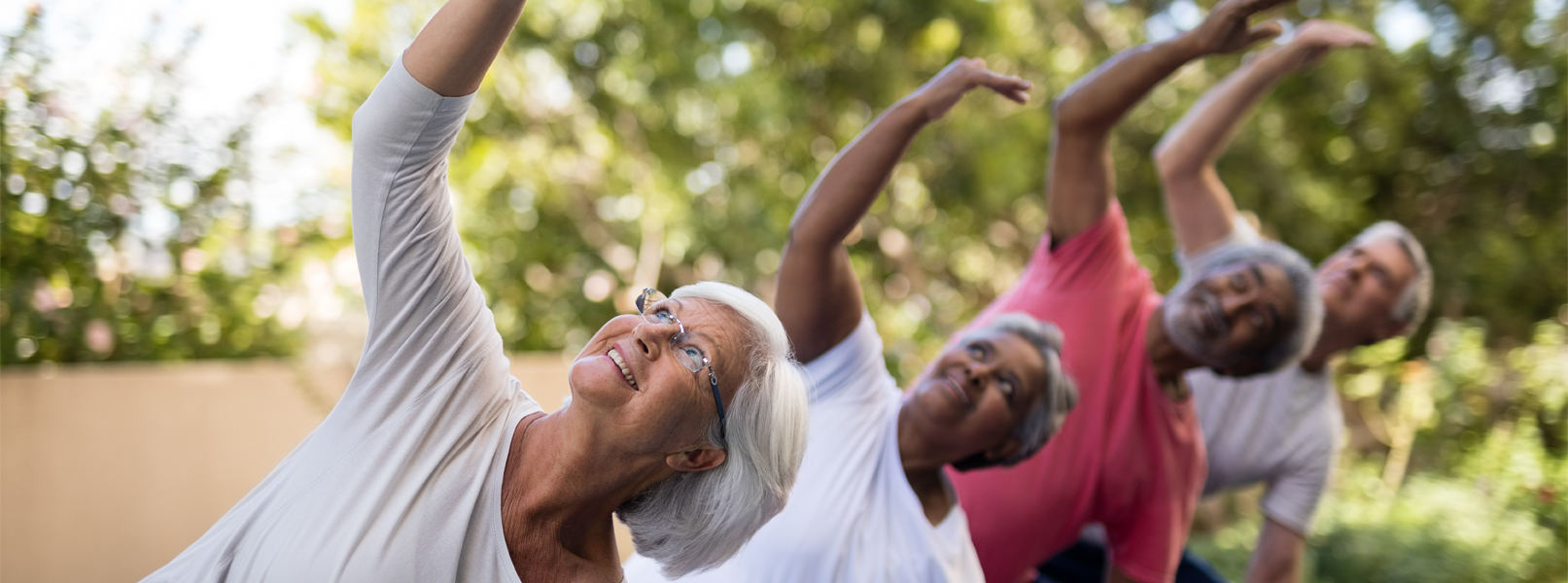 Senior citizens enjoy yoga outdoors as one kind of senior resource in West Covina, CA.