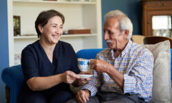 A senior man receives in-home care.