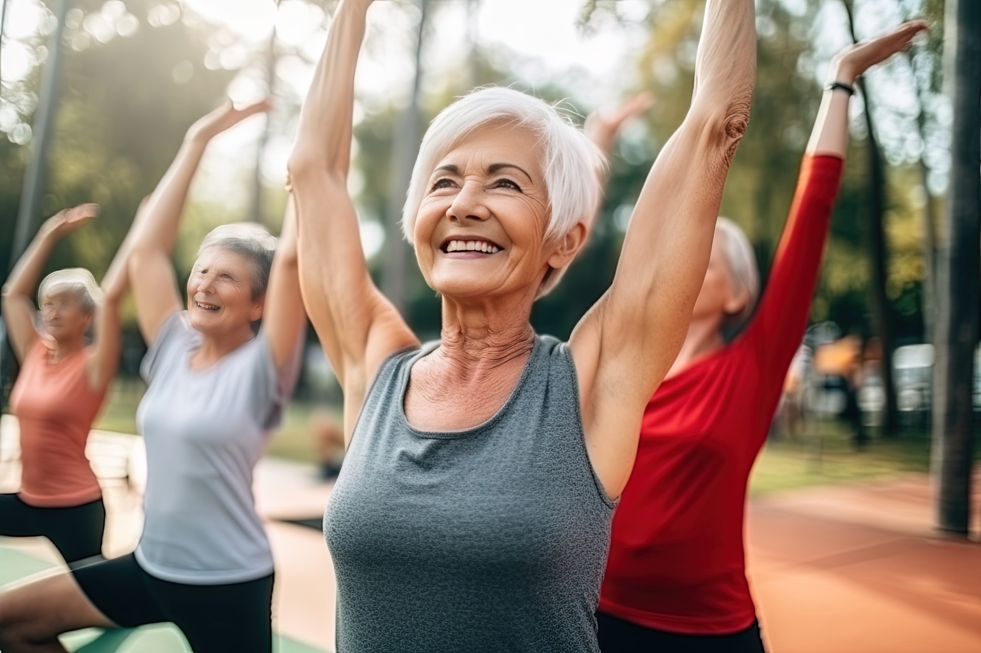 Women participating in a class that specializes in exercises for seniors improve their balance and core strength.