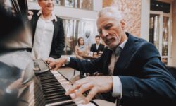 As part of his music therapy and Alzheimer’s care plan, an older gentleman plays the piano regularly for his fellow nursing home residents.