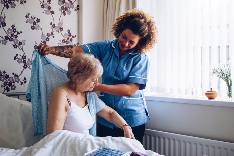 A female client receives post hospital care at home.