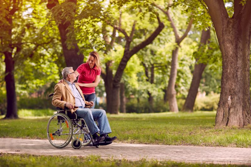 A wheelchair-bound man enjoys the companionship of his respite caregiver.